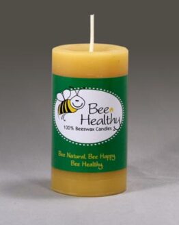 A short round gold pillar candle