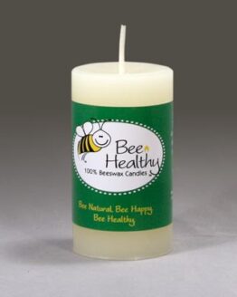 A short round white pillar candle