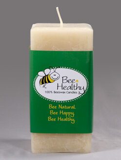 A stocky white pillar candle