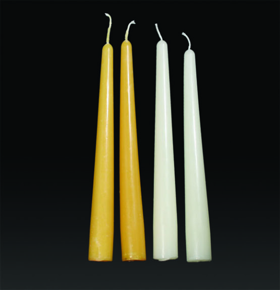 A gold taper candle eight inches