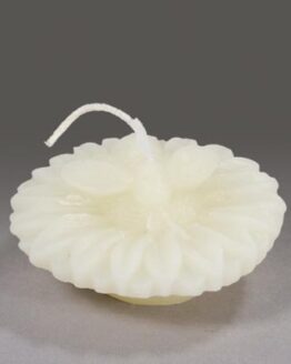 A white floating bee shaped candle