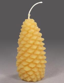 A large gold pinecone shaped candle