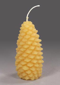 A large gold pinecone shaped candle
