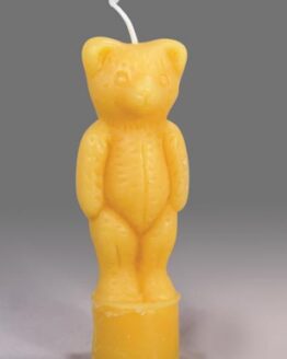 A gold standing bear shaped candle