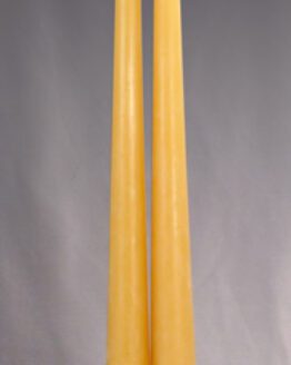 A gold taper candle 10 inches