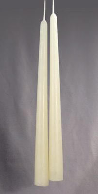 A white taper candle 10 inches