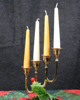A white taper candle six inches