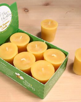 A box of gold votive candles