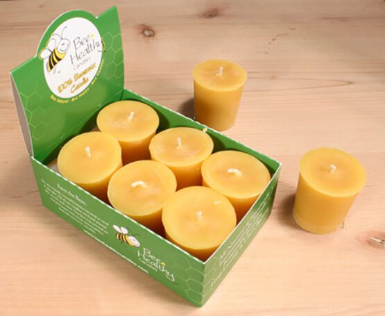 A box of gold votive candles