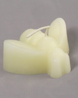 A white bee shaped beeswax candle