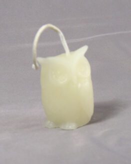 A white owl shaped candle