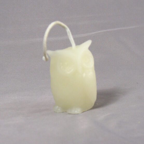 A white owl shaped candle